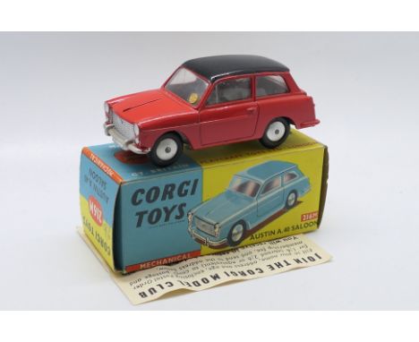 Corgi Toys - A boxed Corgi Toys #216M 'Mechanical' Austin A40 Saloon. The model with red body and black roof with spun hubs, 