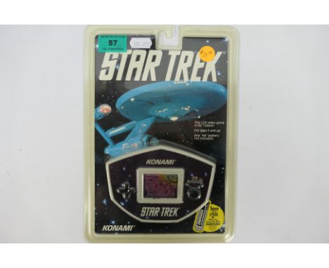 Konami - An unopened 1992 Electronic Star Trek hand held game. The item appears in Mint condition. The plastic packaging is s