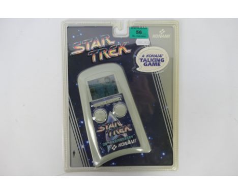 Konami - An unopened 1991 Electronic Talking Star Trek 25th Anniversary hand held game. The item appears in Mint condition. T