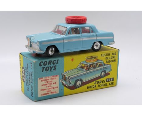 Corgi Toys - A boxed Corgi Toys #236 Corgi Motor School Car. The right hand drive model in light blue, red interior, red roof