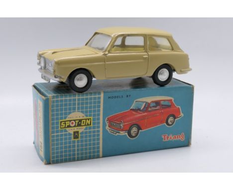 Spot-On - A boxed Spot-On #154 Austin A40. The model in tan with cream interior, spun hubs, chrome trim and grey steering whe