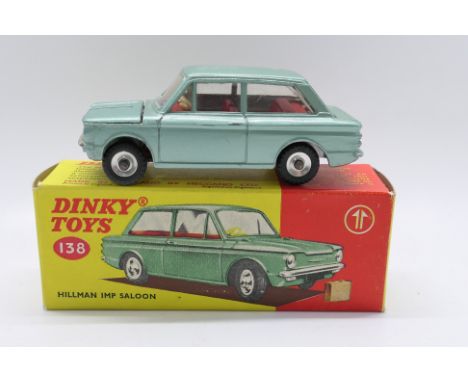 Dinky Toys - A boxed Dinky Toys #138 Hillman Imp Saloon. The model in metallic green with red interior, complete with tan lug