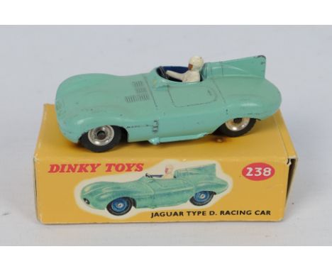 Dinky Toys - A boxed Dinky Toys #238 Jaguar D-Type Racing Car. The model in turquise with mid blue interior, white driver, bl