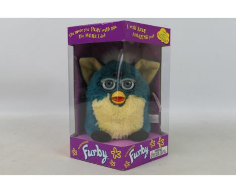 Hasbro - Tiger Electronics - A boxed model #70-800 1999 Generation 4 'Dragon' Electronic Furby by Hasbro. The Furby with teal