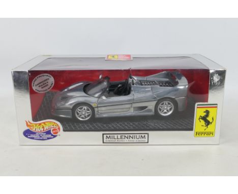 Hot Wheels - A boxed Hot Wheels 1:18 scale Ferrari F50 Millenium Limited Series in chrome. The model appears to be in Mint co