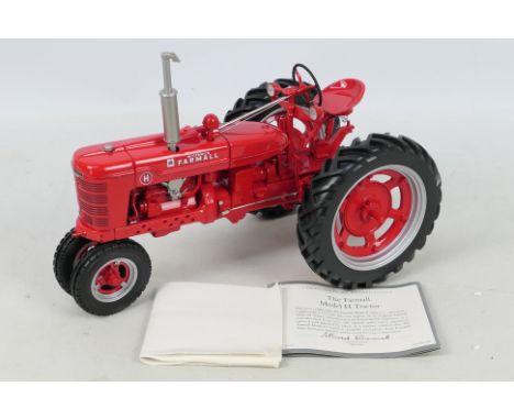 Franklin Mint - A part-built die-cast 1:12 Farmall Model H FMPM tractor in red livery. Model is presented in inner polystyren