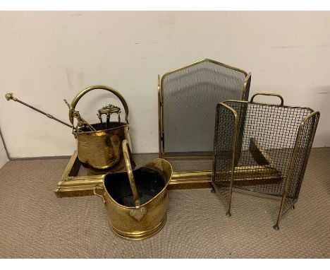 A selection of brass fire screens and tools 