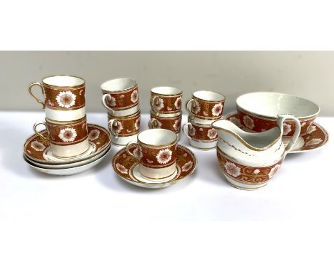A first half 19th c. coffee set with floral and gilt decoration, nine cups (varying sizes), milk jug, 12 cm, three saucers, p