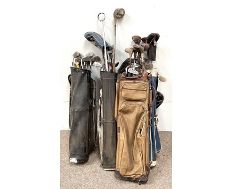 A collection of vintage golf clubs in four bags., (A Lot)