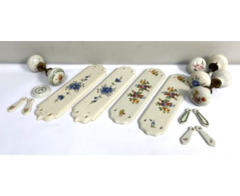A box containing ceramic door knobs, push plates, (A Lot).  *Please note one of the push plates has been damaged*
