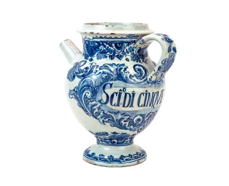 An Italian blue and white Maiolica wet drug or syrup jar.  Early 18th century, with foliate scroll decoration and labelled fo