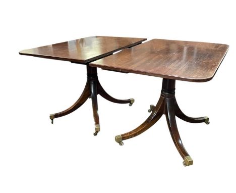 A Regency style mahogany dining table. Early 20th century, raised on plain turned pillar supports, and quadruple outsplay fee