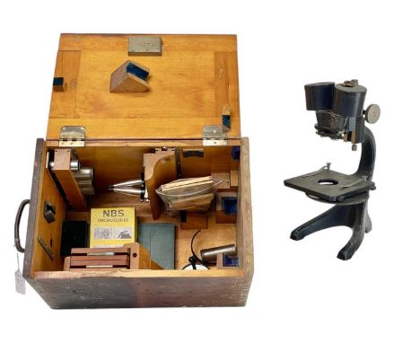 A Carl Zeiss binocular microscope. Together with a collection of glass microscope slides, a copy of Microscopy by Robert M Ne