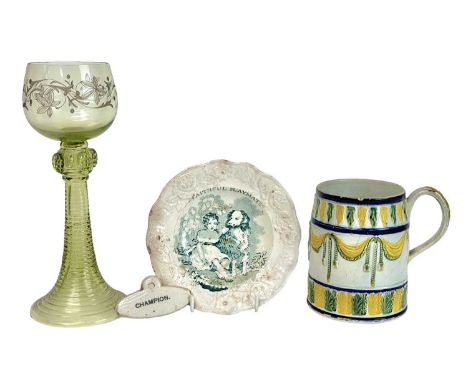 A Pratt Ware mug circa 1800. Moulded with drapery and foliate borders decorated in blue, green and ochre, height 10.5cm toget
