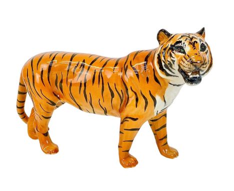 A Beswick figure of a tiger. Length 29cm.The item is in very good condition, no cracks, chips or signs of repair.
