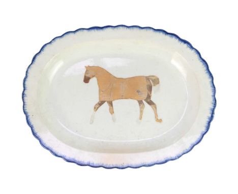 A folk art pearlware blue feather edged platter. Circa 1820, later mounted with a collage of a horse, width 39.5cm.