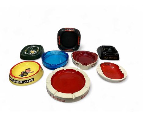 Eight assorted vintage glass and ceramic advertising ashtrays. Including; Brickwoods Ales, Champagne Pol Roger, Haig Whisky, 