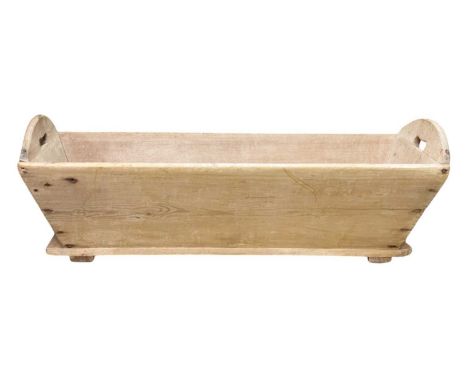 A Victorian pine trough or flour bin. with shaped end handles, height 36.5cm, width 114cm, depth 46cm.
