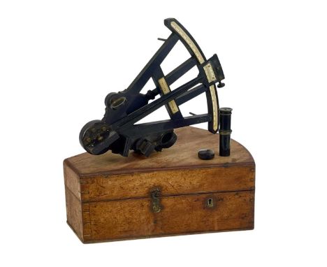 An ebony octant by R Millar, Leith. Circa 1850, with a lacquered brass radius arm and vernier scale, cased, height 34cm.