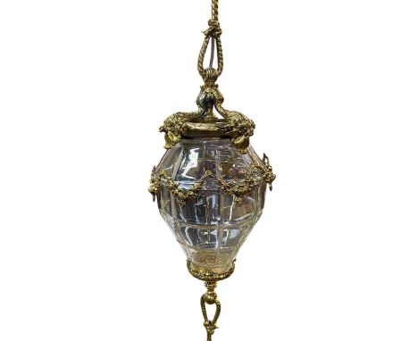 A French lacquered brass hanging stairway lantern. With long twisted support, cut glass shade and tassel form drop, height 13