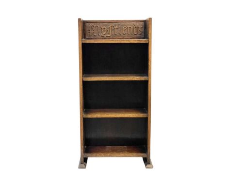 An Arts and Crafts small oak bookcase. The top shelf carved 'My Friends', with an applied label 'Homettes', 83cm high. width 
