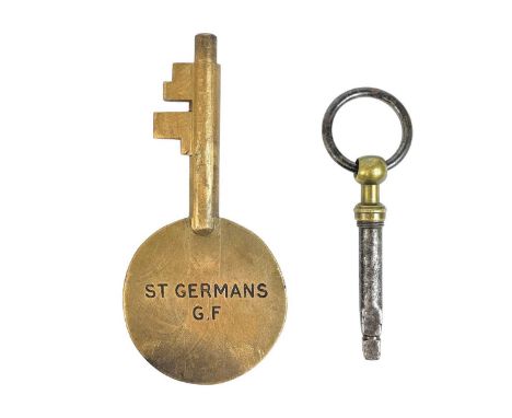 A GWR bronze Annetts key stamped St Germans G F. Length 14cm together with a rare combined railway guards corkscrew and carri