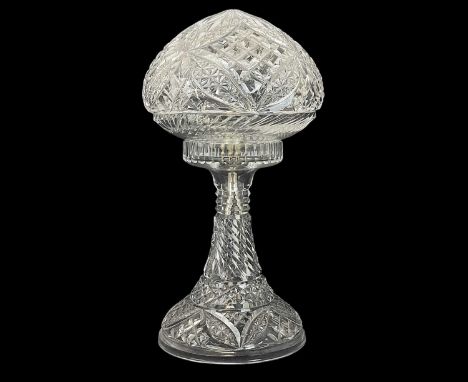 A cut glass table lamp and mushroom shade. 20th century, with star and lozenge cut decoration, height 32cm.