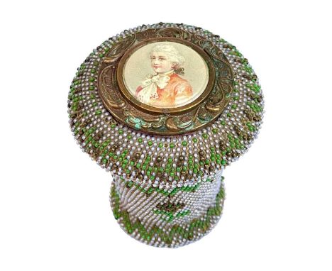 A beadwork decorated treen pot. 19th century, the threaded lid with painted porcelain portrait plaque and mirror within, heig
