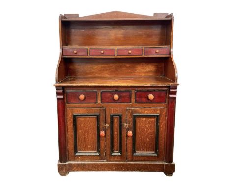 A Victorian Scottish lowlands scumbled pine and mahogany kitchen dresser.  The raised back fitted three drawers and a shelf, 