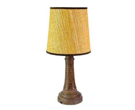 A teak lighthouse table lamp probably from the timbers of HMS Warspite. Height 31cm.