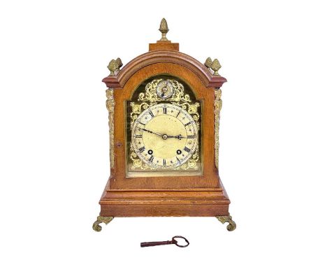 A Winterhalder and Hofmeier German walnut cased mantel clock. Retailed by Mappin &amp; Webb, with cast brass mounts and feet,