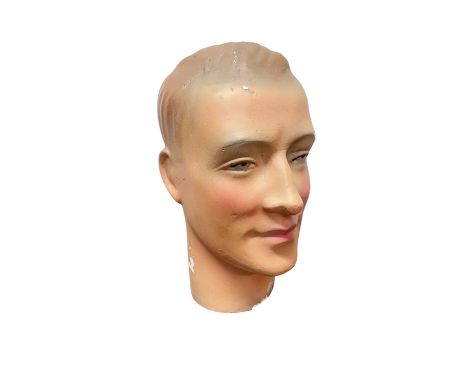 A plaster male mannequin head. Mid-century, with painted details, height 30cm.