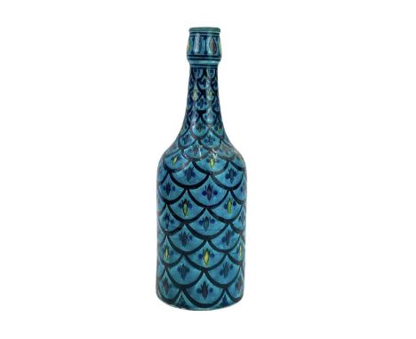 A Safi earthenware bottle. With fish scale decoration on a turquoise ground, height 30cm.