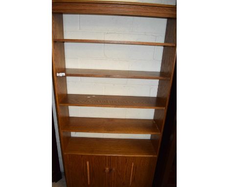 LIGHT OAK FINISH BOOKCASE CABINET WITH CUPBOARD BASE