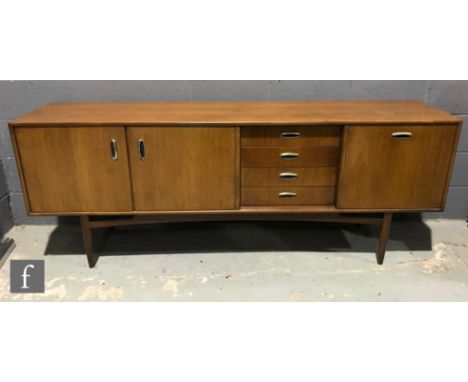 Victor B Wilkins for G-Plan - A model number 4058 teak sideboard, fitted with an arrangement of four central drawers, flanked