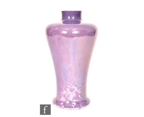 Ruskin Pottery - A vase of high shouldered tapering form decorated in an all over lavender lustre, impressed mark and dated 1