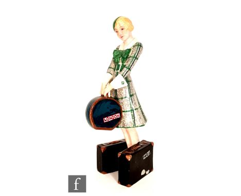 Josef Lorenzel - Goldscheider - A 1930s Art Deco figure, model 7064, modelled as a fashionable lady in a green plaid dress an