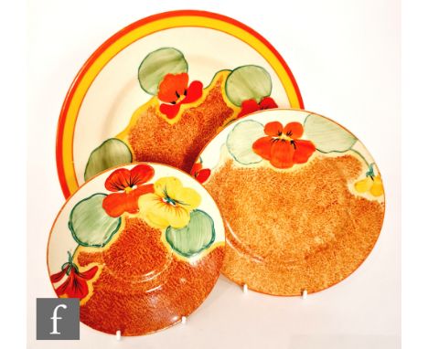 Clarice Cliff - Nasturtium - A large circular plate circa 1933, hand painted with stylised flowers and foliage over a stipple
