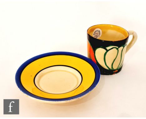 Clarice Cliff - Black Lily - A Tankard shape coffee can and saucer circa 1929, hand painted with a stylised flower and foliag