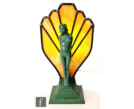 Unknown - A 1930s table lamp with a stepped rectangular base supporting a green painted standing nude female in front of a ma