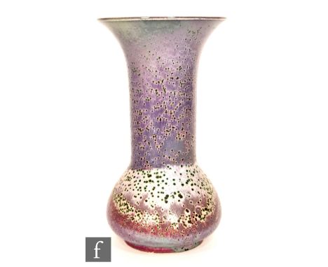 Ruskin Pottery - A high fired vase of globe and flared shaft form decorated in a tonal lavender and blue glaze with copper gr