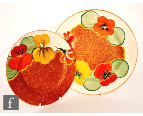 Clarice Cliff - Nasturtium - A large circular plate circa 1932, radially hand painted with stylised flowers and foliage over 