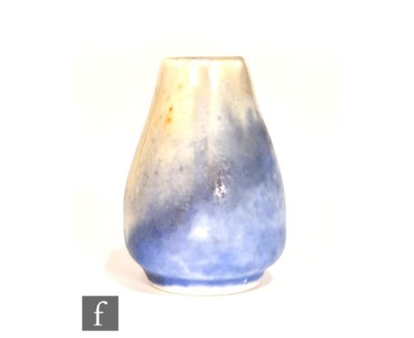 Ruskin Pottery - A miniature vase of swollen form decorated in a yellow to blue crystalline glaze, impressed mark, height 3.2