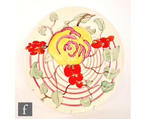 Clarice Cliff - Damask Rose - A circular plate circa 1933, hand painted with a stylised flowering bough over fine banded pink