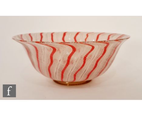 Venini - A 1960s glass bowl of high sided form with orange and opal latticinio cane work decoration, raised to a ring foot wi