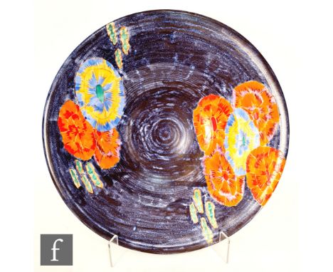 Clarice Cliff - Inspiration Clovre Waterlily - A large 18in ribbed charger circa 1930, hand painted with stylised water lilie