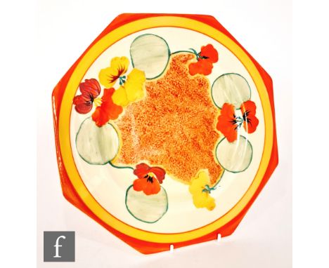 Clarice Cliff - Nasturtium - A large octagonal plate circa 1933, hand painted with stylised flowers and foliage over a stippl