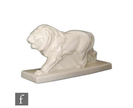 Unknown - A 1930s Art Deco model of a stylised prowling lion, the whole with a craquelure glaze, unmarked, length 45cm. 