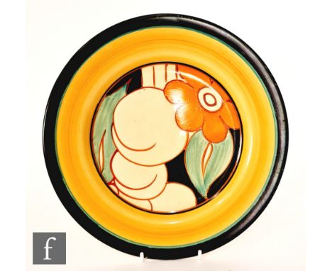 Clarice Cliff - Floreat - A circular plate circa 1930, hand painted with stylised fruit and flowers over a black ground with 