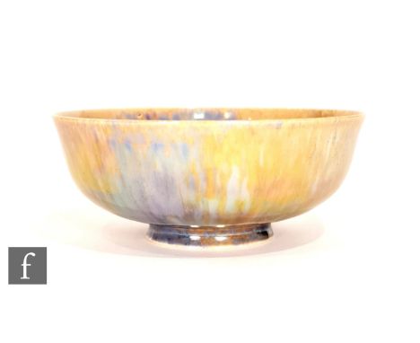 Ruskin Pottery - A small footed eggshell bowl decorated in a mottled blue and yellow lustre, impressed mark and dated 1925, d